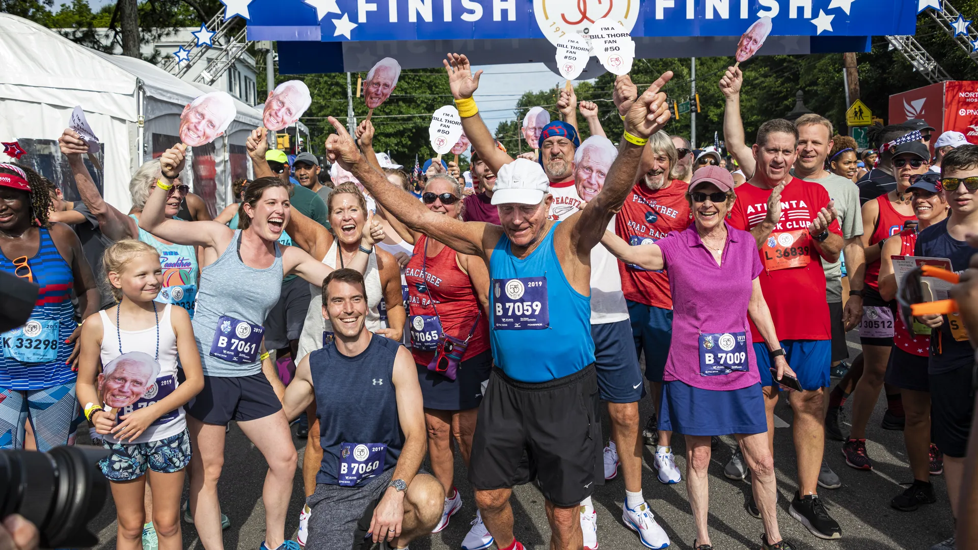 Active patients celebrating at a race finish line